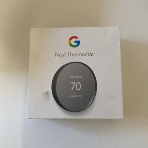 Nest Thermostat, new in box never used. Charcoal finish.